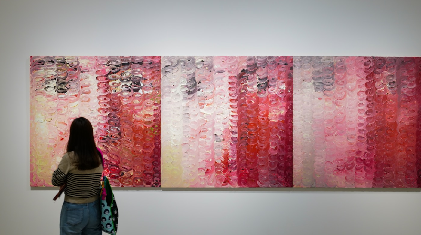 Visitor viewing paintings